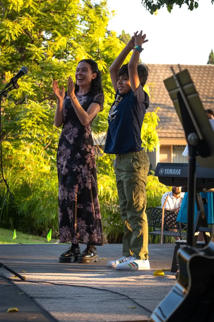 Students performing for family and friends at an OC Music Services recital